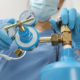 Medical Worker Checking Oxygen Tank In Hospital Room, Closeup